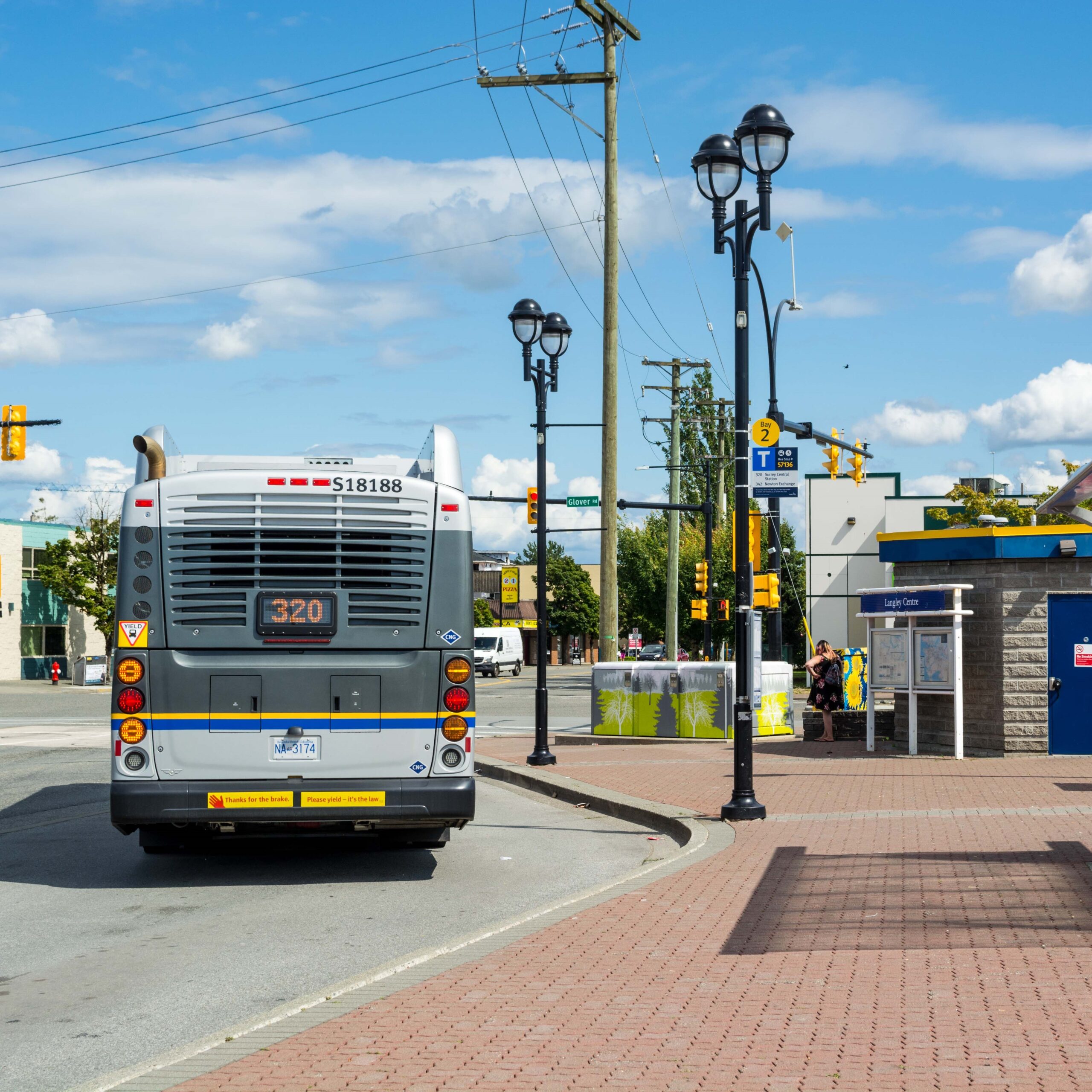 The rear of a TransLink bus on route 320 leaves the Langley Centre exchange.