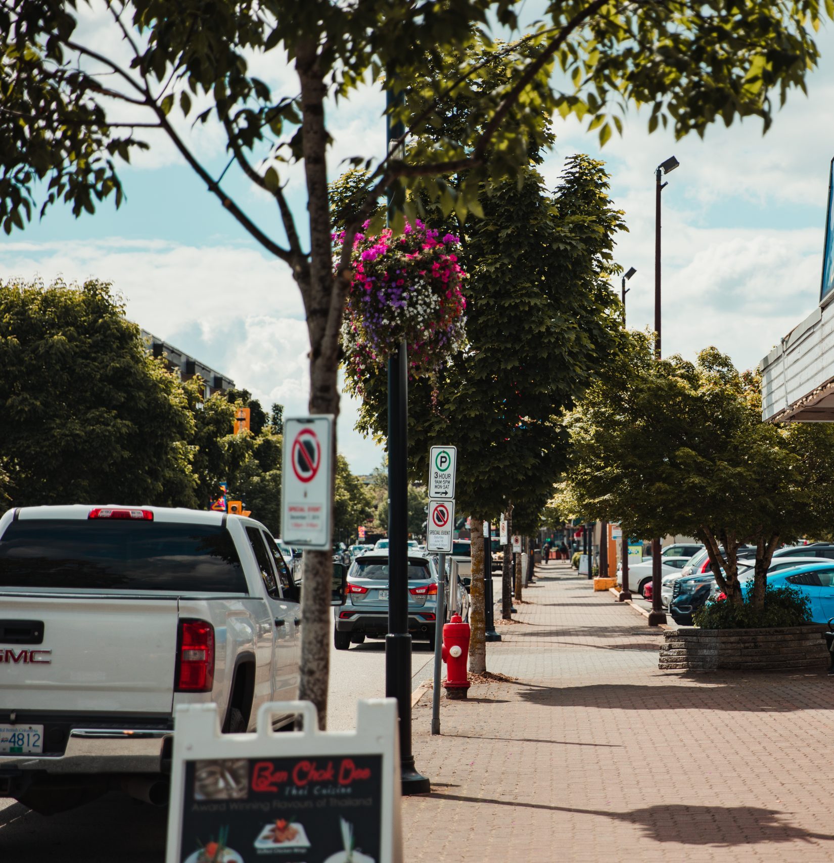Cars parked along street.