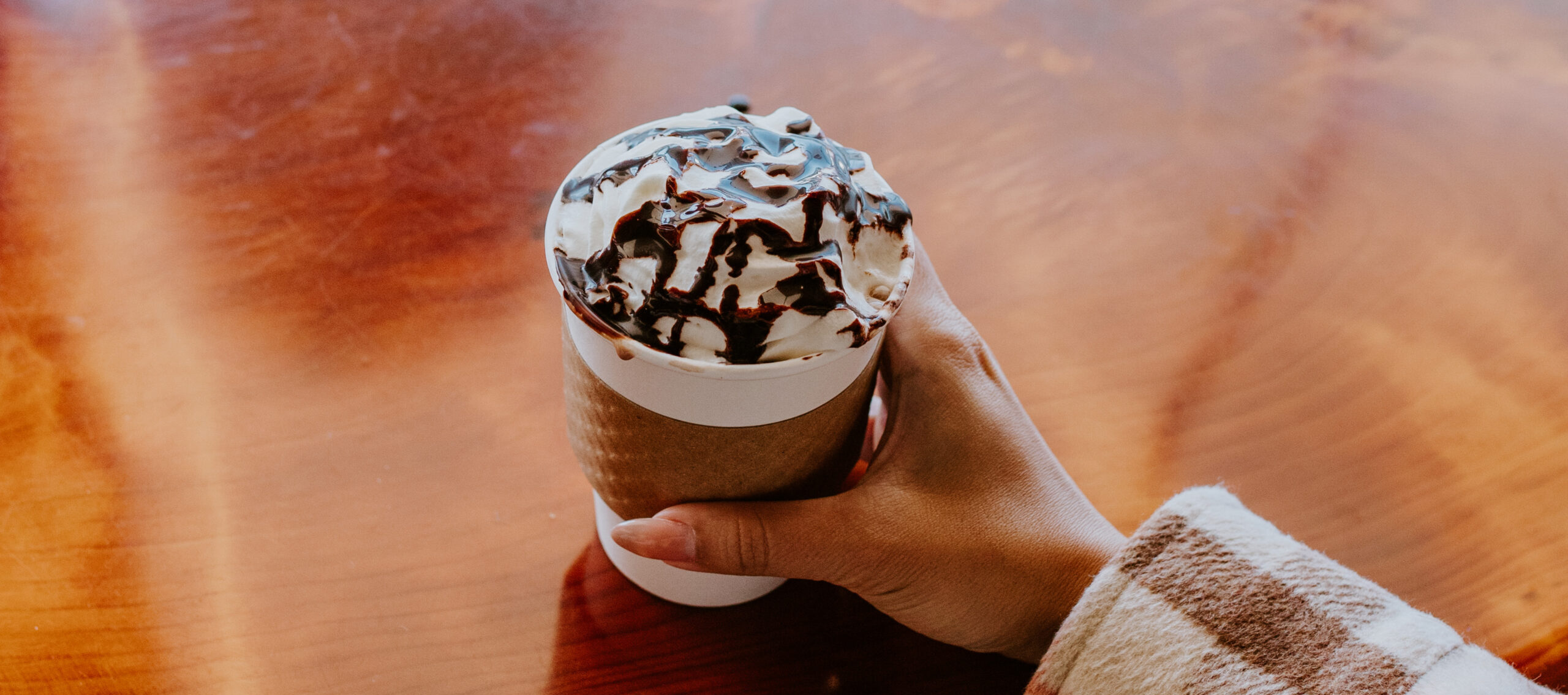 Racing in a go kart on a track.